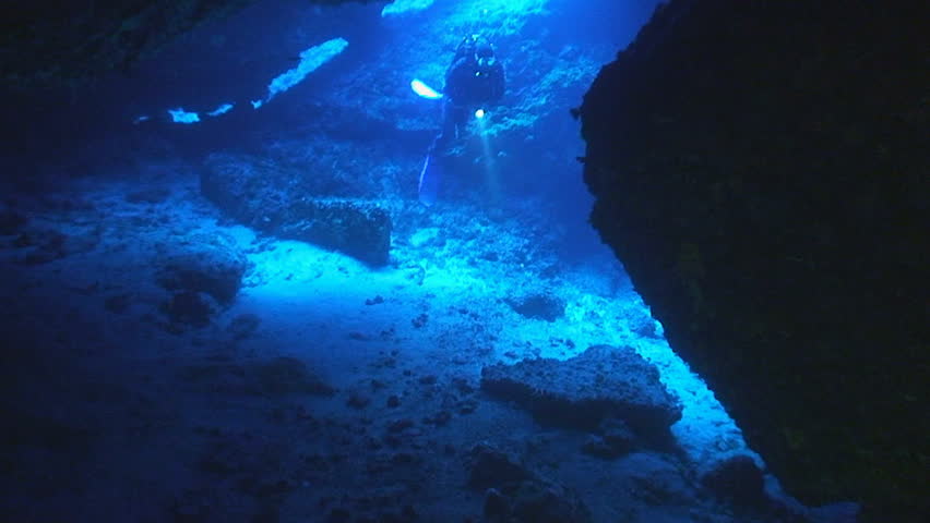scuba diver in cave, mediterranean sea