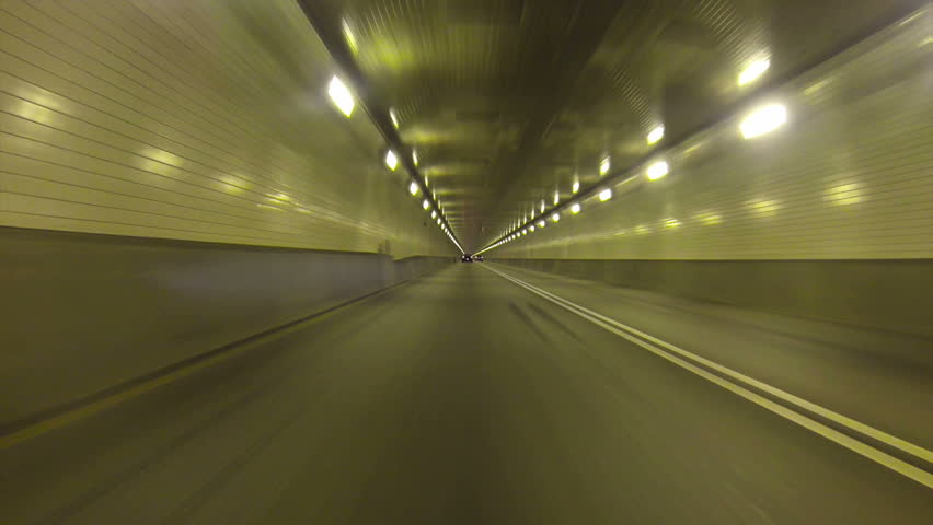Low-angle perspective of driving inside the Fort Pitt Tunnels in Pittsburgh,
