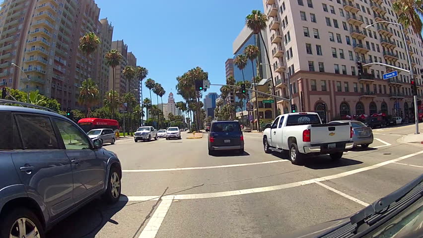 The camera rolls down Ocean Boulevard by the buildings of the downtown area