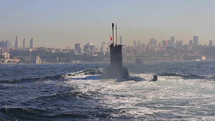 Riding on the wake of the submarine. Navy Submarine moving into Bosporus waters.