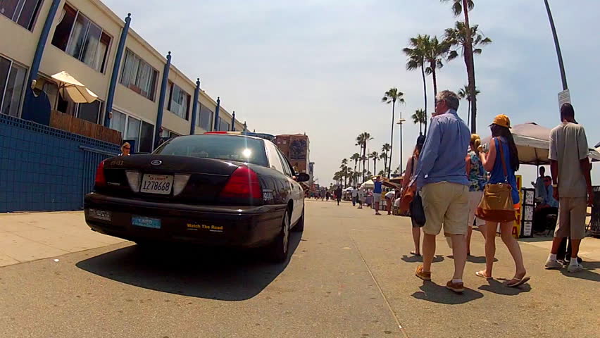 VENICE BEACH, CA/USA: July 18, 2013- A police cruiser patrols the boardwalk