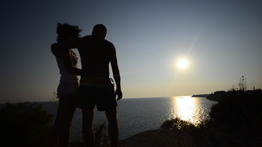 Sunset Romance, Couple hugging and kissing At Sunset, Beautiful Young Couple in