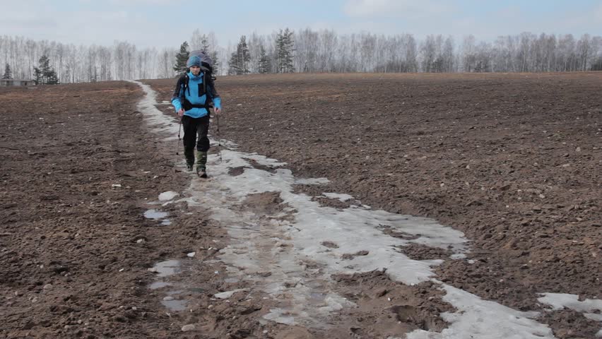 Tourist goes down the route. Close and front view.
