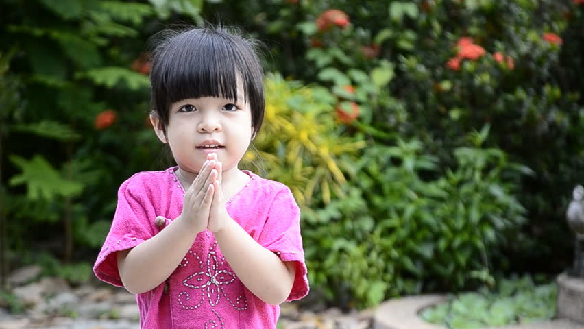 cute asian baby girl in action salute with hand of thailand