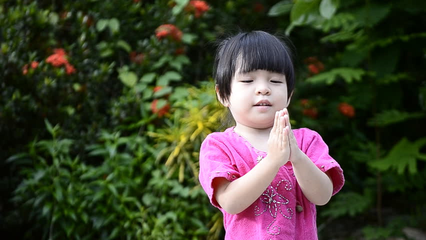 cute asian baby girl in action salute with hand of thailand
