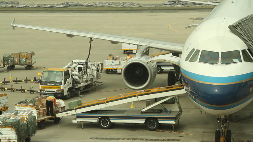 SHENZHEN, CHINA - DECEMBER 15: Airliner at gate loading and refueling in
