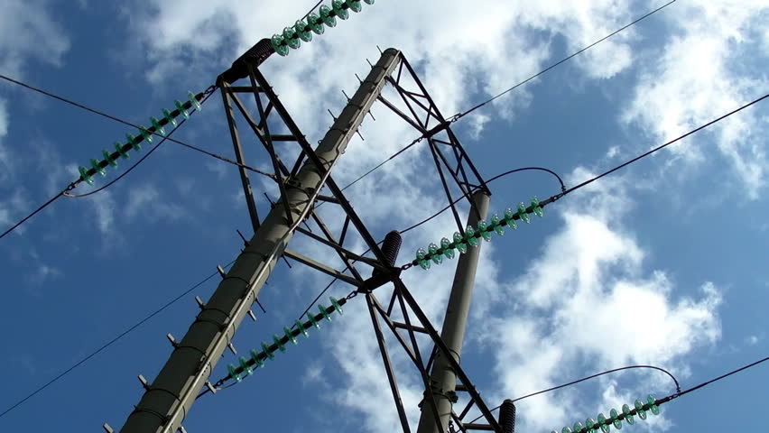 electrical transmission tower and power lines with blue sky