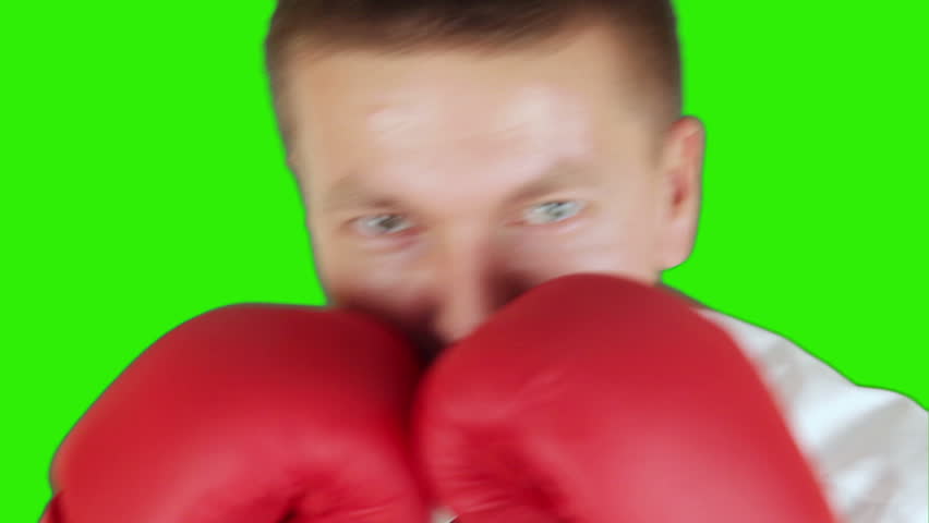 Young businessman boxing and hitting himself, close up, Green Screen