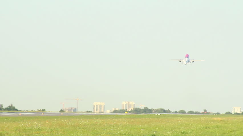 Long shot of aircraft takeoff and fly up gaining height