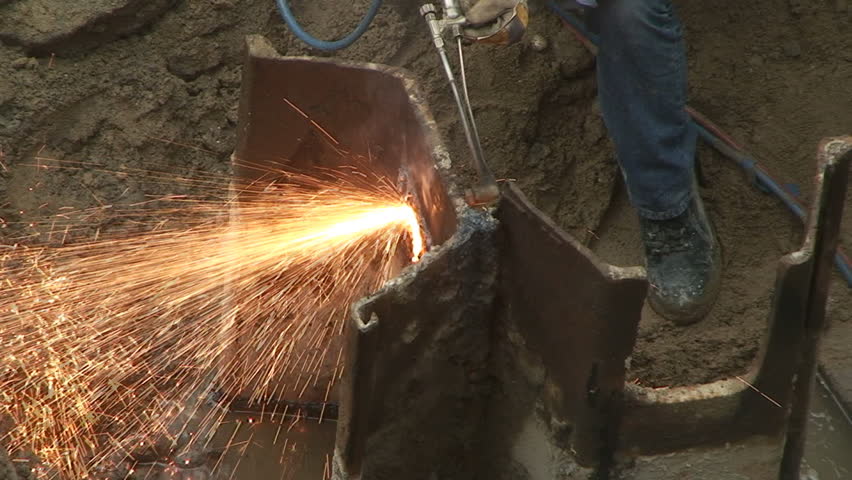 Sparks fly from welding torch