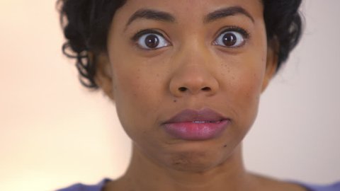 Black woman pretending to accidentally swallow bubble gum