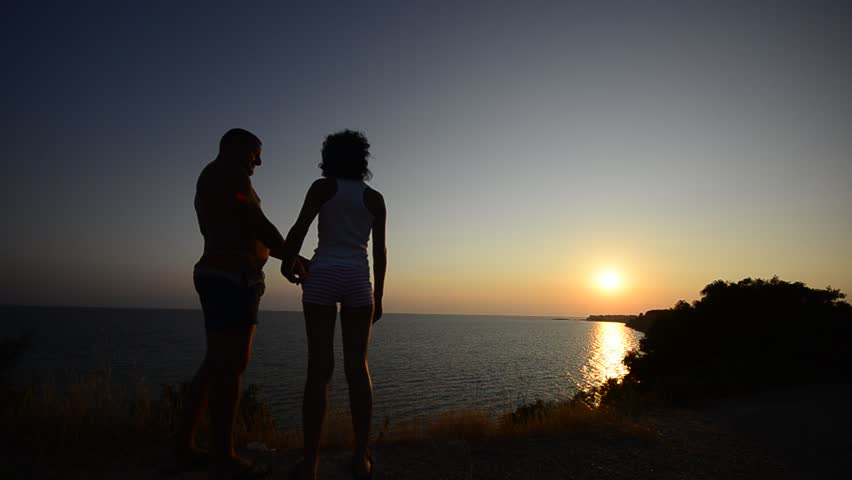 Romantic couple hug and kiss on the ocean beach sunset, Romance on the beach