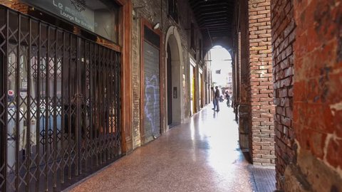 Bologna, Italy - July 7, 2013: Bolgona city located in northern Italy famous for the arcades. In summer the center is closed to cars available to pedestrians and cyclists