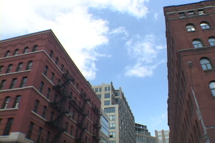 Time lapse of clouds passing over New York City buildings.