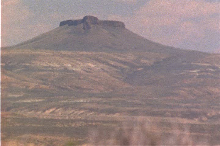 WS distant butte in Red Desert seen through heat haze in Wyoming.