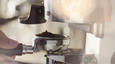 Making Ground Coffee with Coffee Grinder. Close-Up. Shot on RED Digital Cinema Camera in 4K (ultra-high definition (UHD)), so you can easily crop, rotate and zoom, without losing quality!