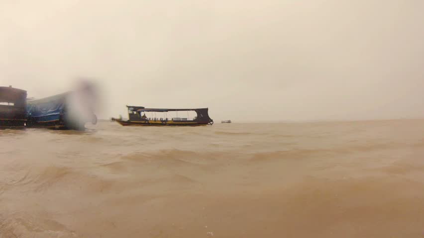 Mekong Delta, Vietnam - boats, rainy weather.
