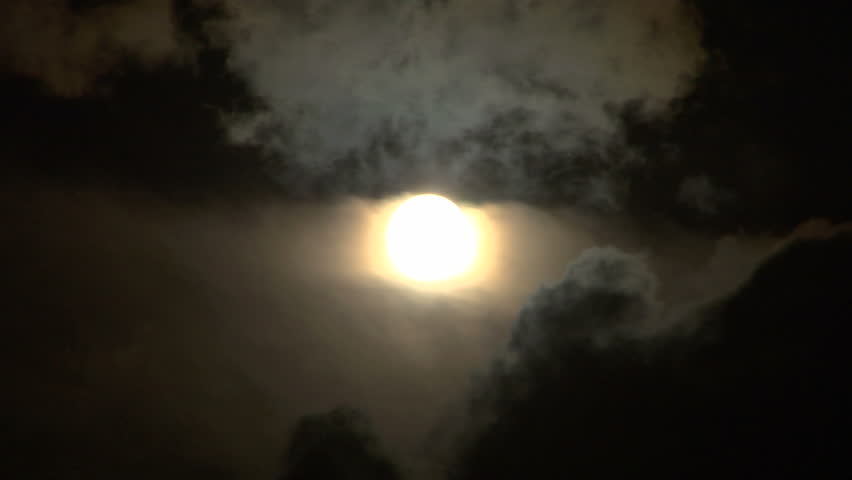 Full glowing moon on cloudy foggy night sky time lapse