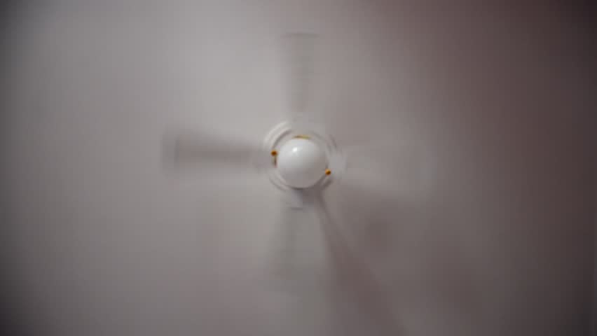 Spinning ceiling fan closeup. Electric fan produce a current of air by fast