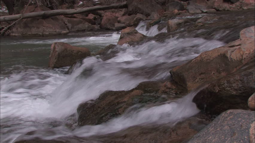 Fast flowing river over rocks at Zion National Park, Utah
