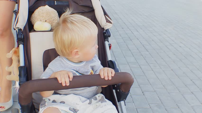 child rides in a stroller
