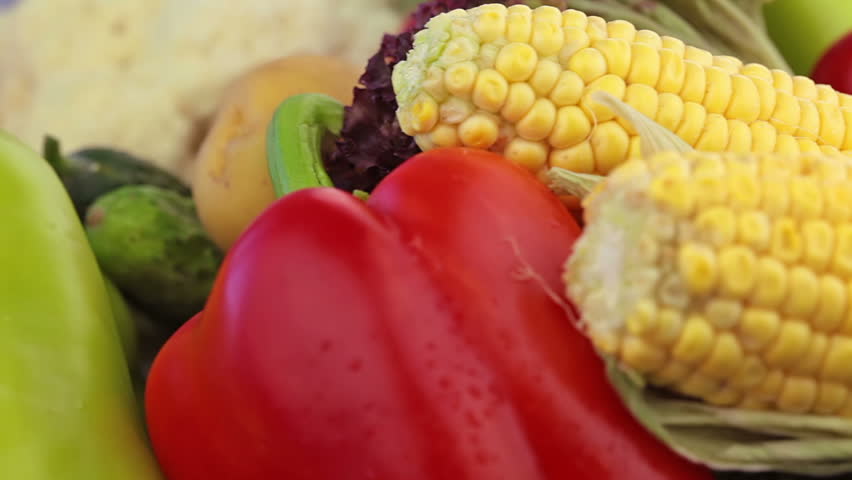 Ripe, juicy corn and other vegetables are slowly moving in front of your eyes.