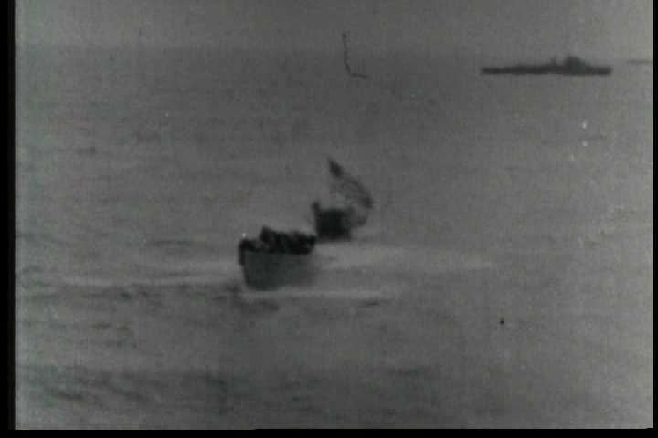 1950s - The U.S.S. Guadalcanal tows a German U boat on the high seas during World War Two and POWs are treated.