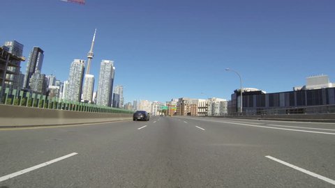 Drive Into Toronto 2. Vehicle shot on the Gardiner Expressway driving into downtown Toronto, Canada. POV.