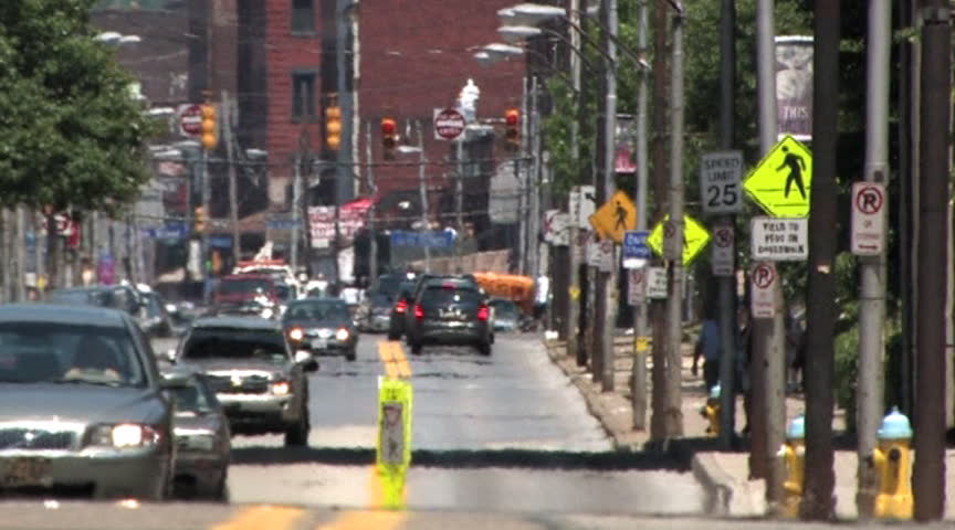 Traffic travels on Penn Avenue in downtown Pittsburgh, Pennsylvania.