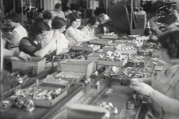 1930s - Women work in factories in 1931.