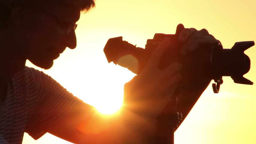 Successful shot by young male photo video shooting tripod camera | Shutterstock HD Video #4399082