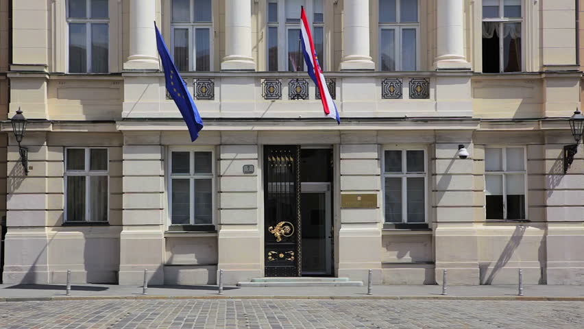 Croatian Parliament (Sabor) building with Croatian and European union flag on it. St. Mark Square, Zagreb.
