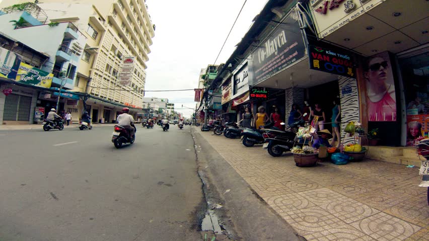 SAIGON - JULY 22: Motorbike journey along Saigon city on July 22, 2013 in Saigon