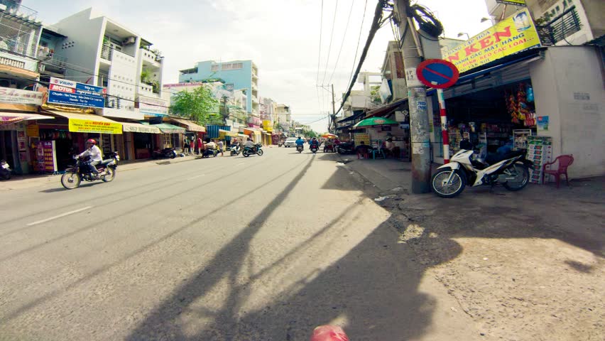 SAIGON - JULY 22: Motorbike journey along Saigon city on July 22, 2013 in Saigon