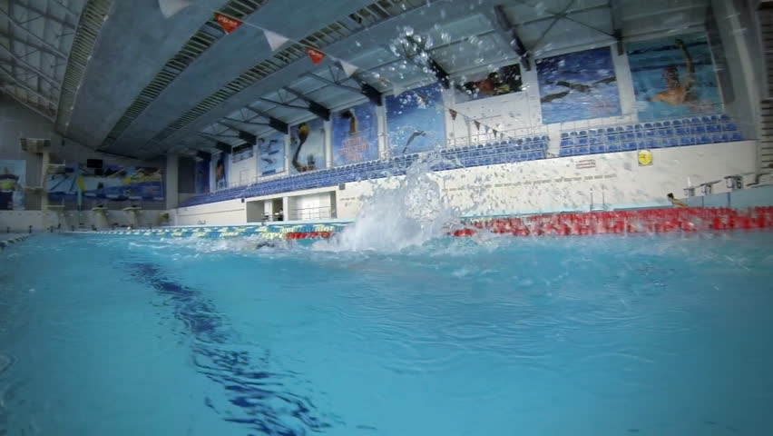 Beautiful slow motion view of athlete who is swim butterfly style