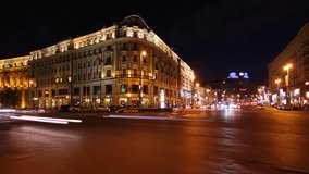 Night city traffic, hotel National, Moscow, time-lapse. Establishing shot.
