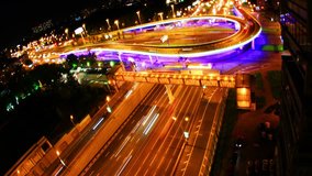 Night city traffic on a freeway, time-lapse.