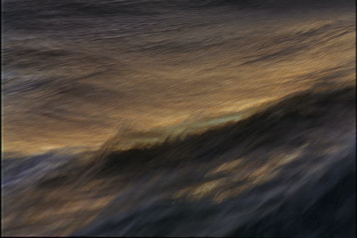 Choppy ocean water rises and falls alongside sailing ship in Bridgeport, Barbados.