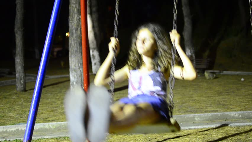 HD Girl on the Swing LOOP. HD1080p a little girl is pushed casually on the swing