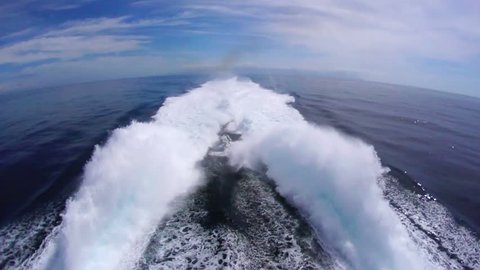 Wake of modern fast super powerful ocean ship, view from aboard.