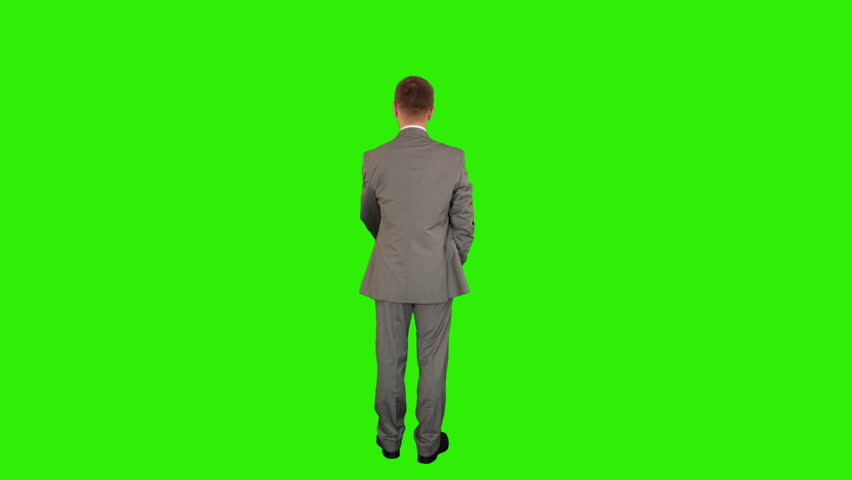 Young businessman opening umbrella, back view, Green Screen