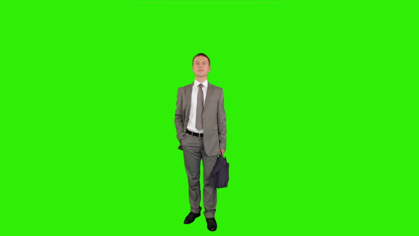 Young businessman with umbrella, Green Screen