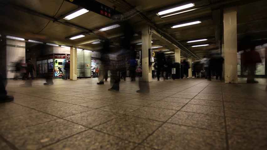 Time Lapse of commuters hurrying through subway station in New York City /