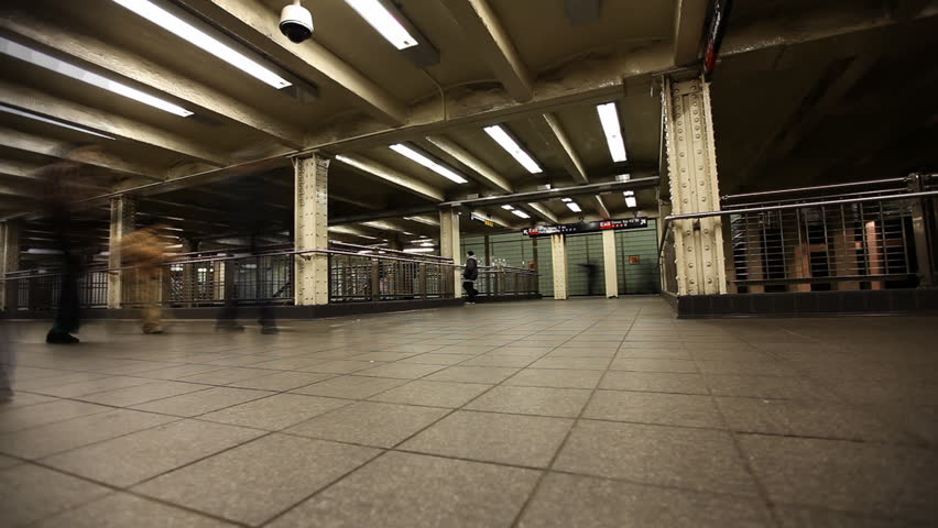Time Lapse of commuters hurrying through subway station in New York City /