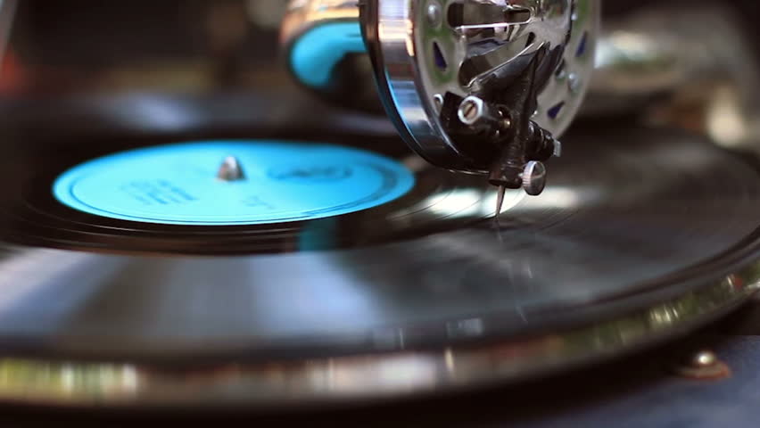 Retro gramophone playing, big fashionable needle scrapes record making music