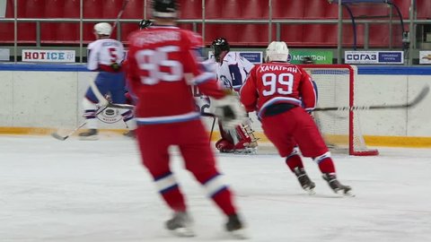 MOSCOW - APR 28: Hockey teams play near gate during match on closing ceremony of championship season of 2011-2012 Ice Hockey for Sports School in Sokolniki on 28 April 2012, Moscow, Russia