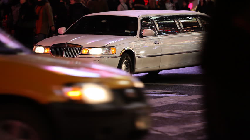 White Limousine stuck in traffic on Times Square Manhattan, New York City /