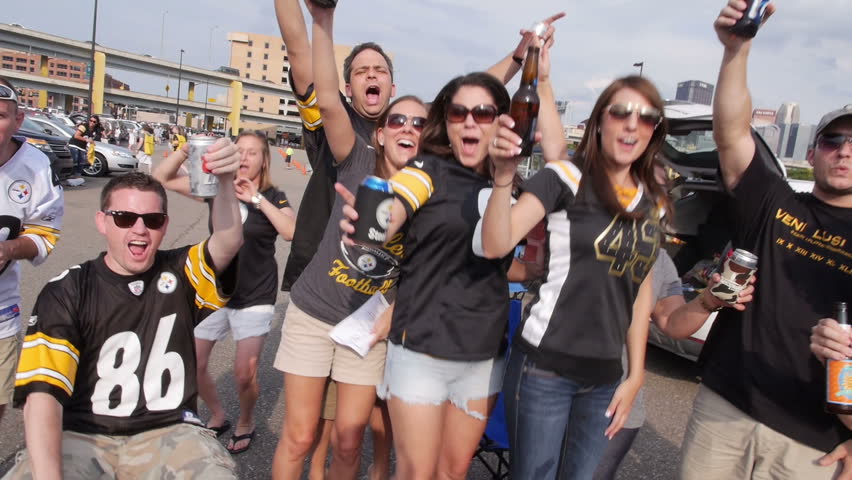 PITTSBURGH, PA, Circa August, 2013 - Sports fans tailgate in a parking lot near
