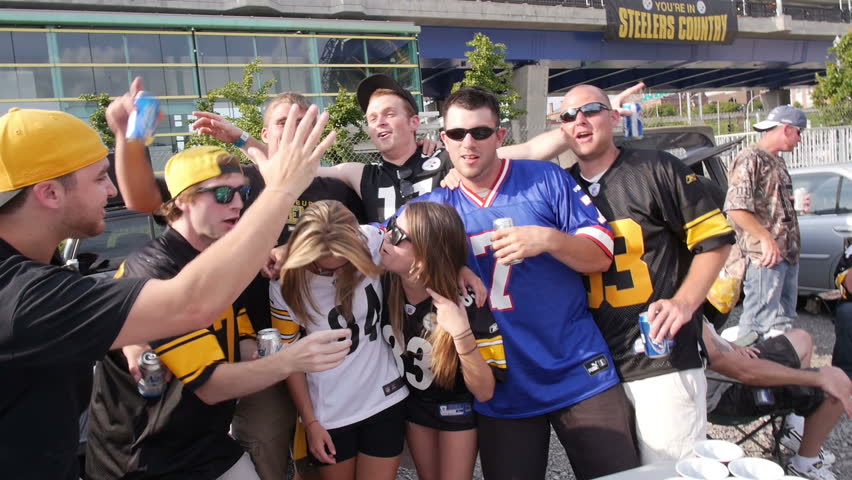 PITTSBURGH, PA, Circa August, 2013 - Sports fans tailgate in a parking lot near