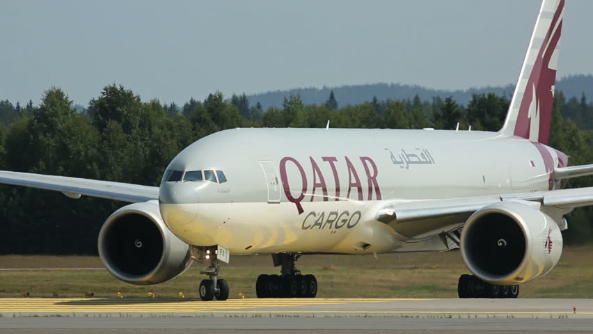 OSLO AIRPORT - JULY 15 2013: Qatar Airways Cargo Boeing 777 taxing for takeoff